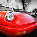 Red retro car on the waterfront of Paris