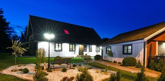 Swedish Villa House with Modern Garden at Night Time