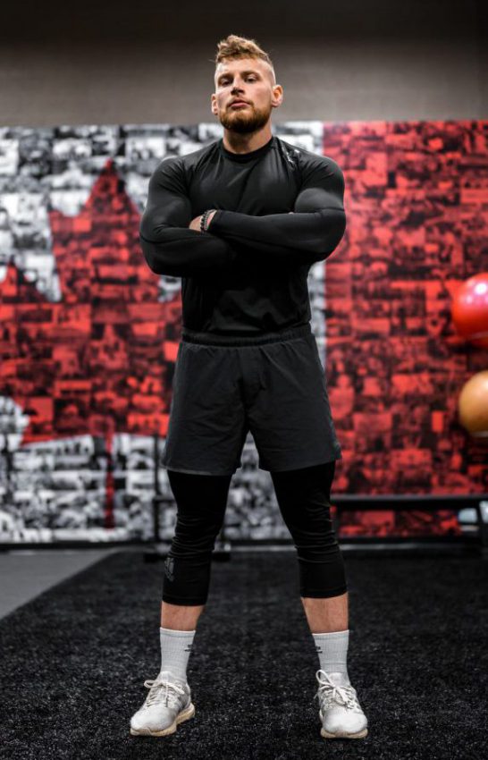 Thomas standing in gym