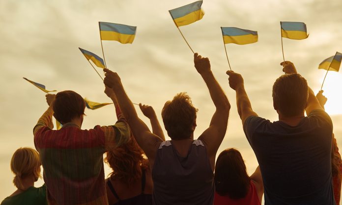 Ukrainian patriots with small flags.