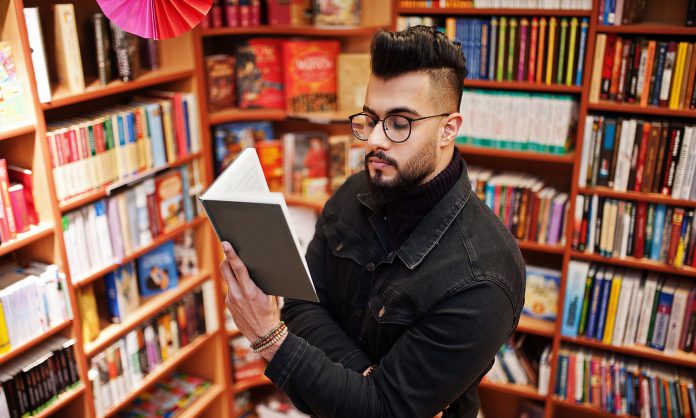Arab student man at library
