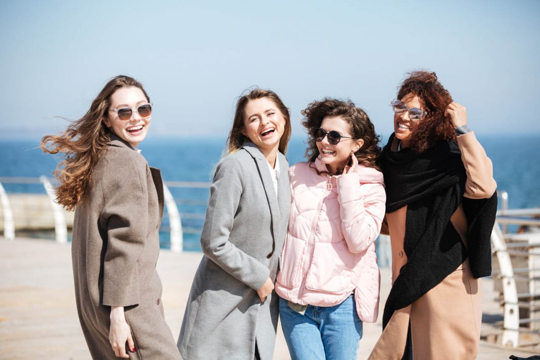 Portrait,Of,Cheerful,Young,Female,Friends,Near,Sea
