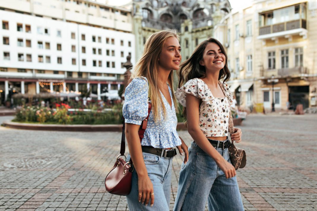 Blonde,And,Brunette,Women,In,Stylish,Loose,Jeans,And,Floral